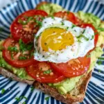 Breakfast Smashed Avocado Tomato Toast with Fried Poached Egg